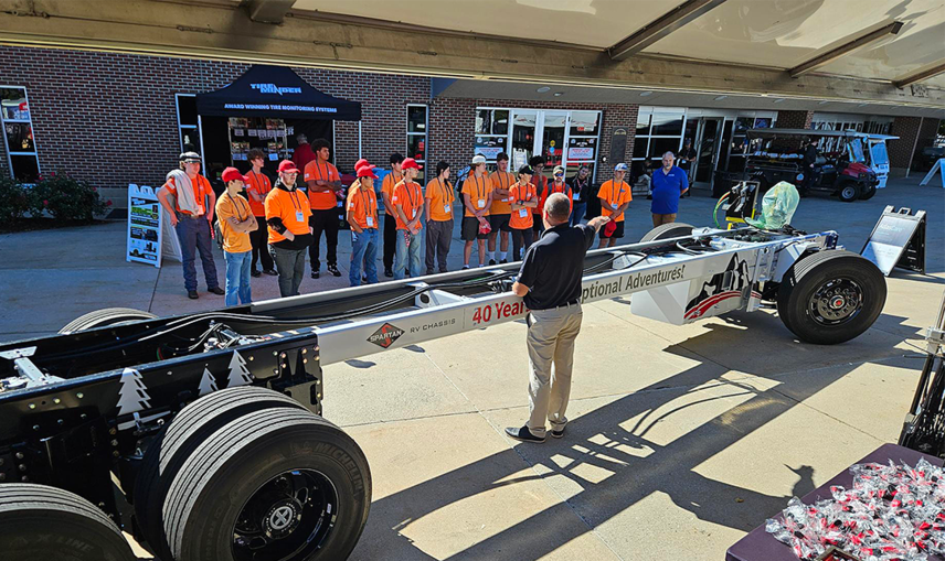 The Spartan team connected with local tech students during educational sessions, sharing hands-on knowledge and a look at the technology behind the chassis.