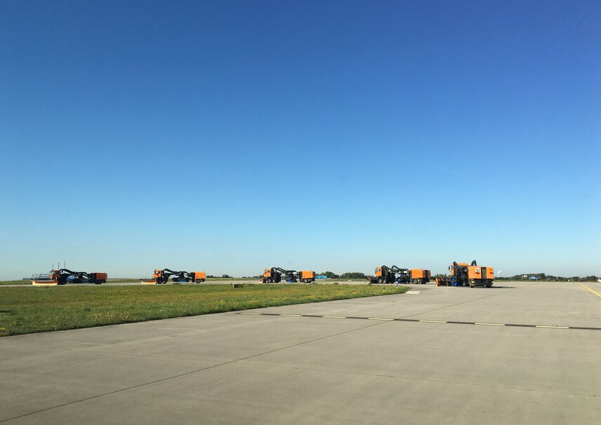 Winter operation training at Leipzig/Halle Airport (LEJ) in bright sunshine.